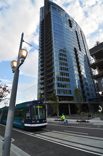 Streetcar passing skyscraper in the South Waterfront District